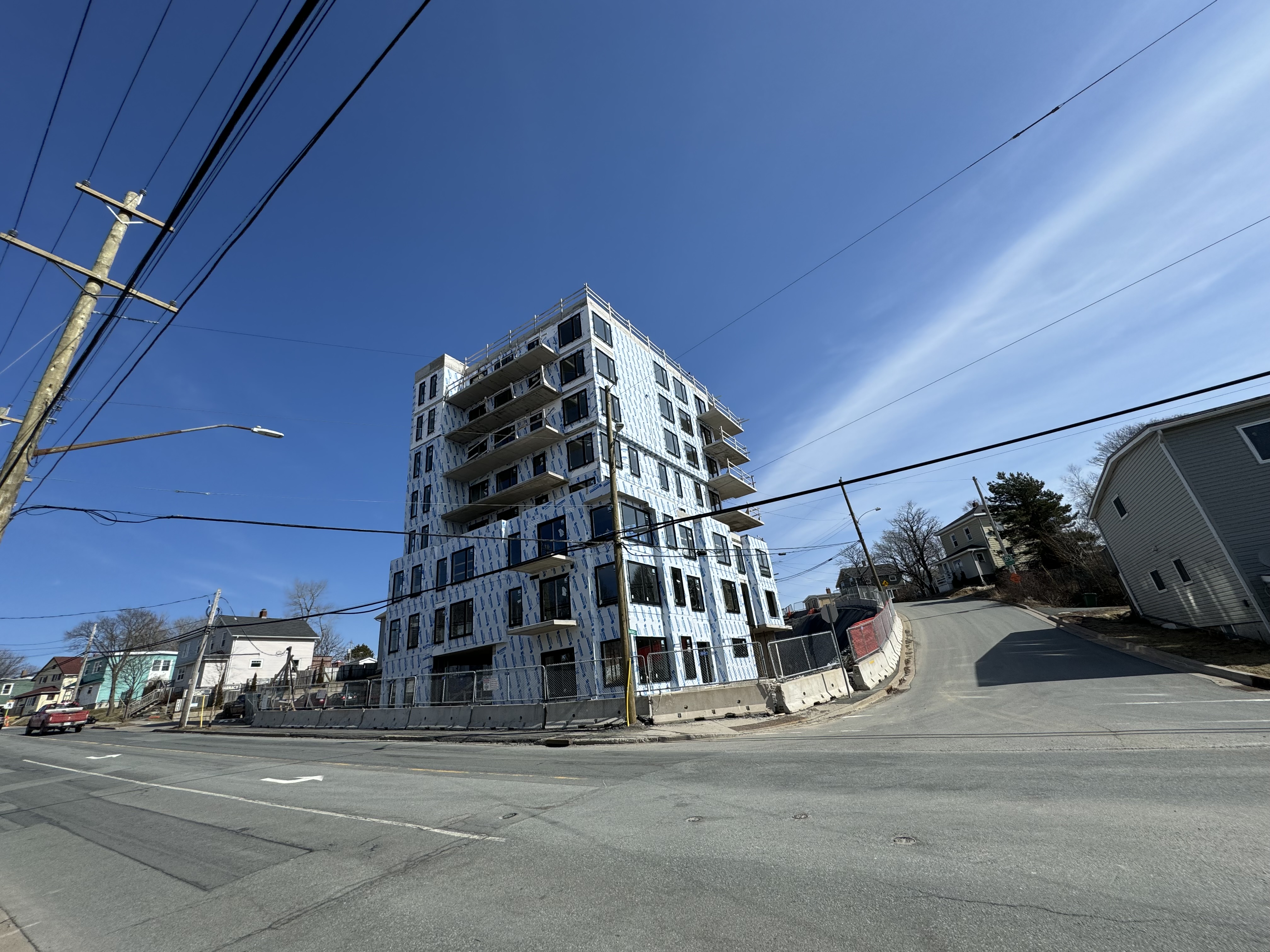 Mid-rise exterior work underway on a commercial multi-unit project in Halifax.