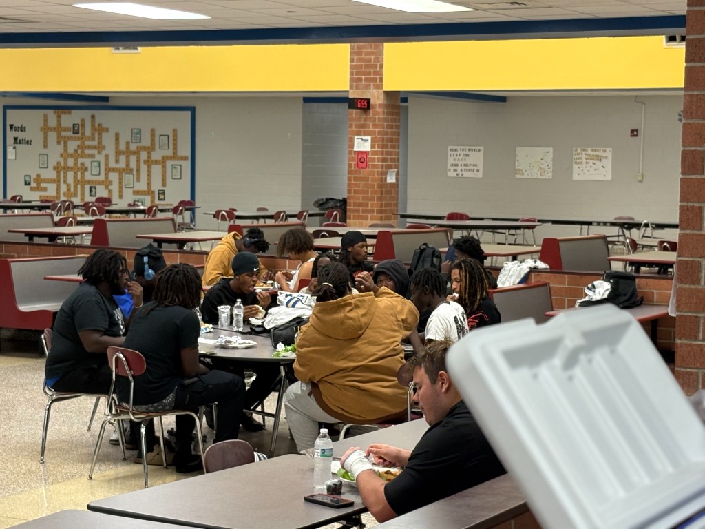 Feeding the homeless outreach meal with volunteers and guests sharing food